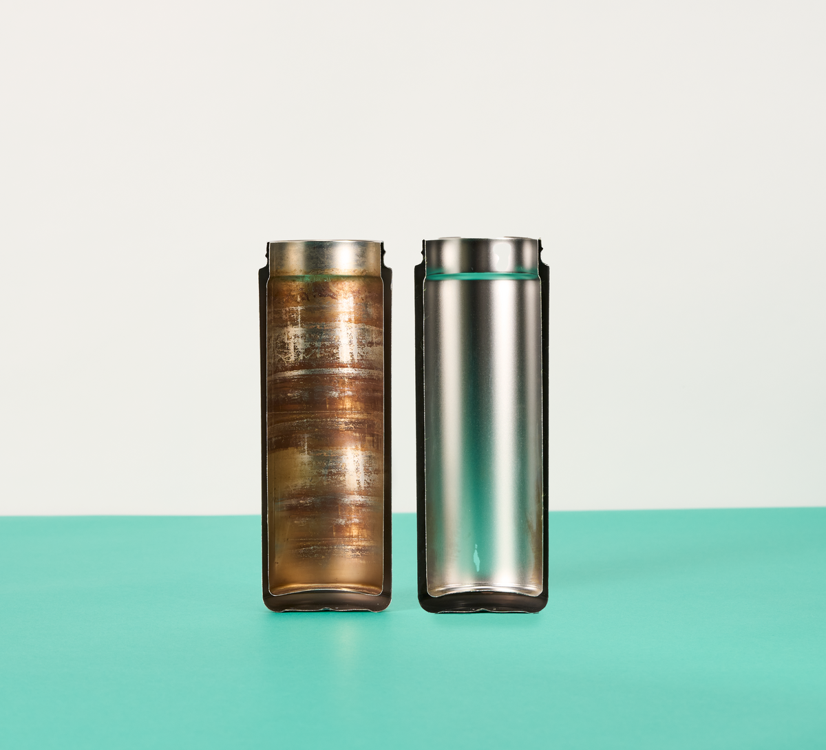 Split view of a clean bottle and a dirty bottle demonstrating the effectiveness of an EcoBrite Tablet